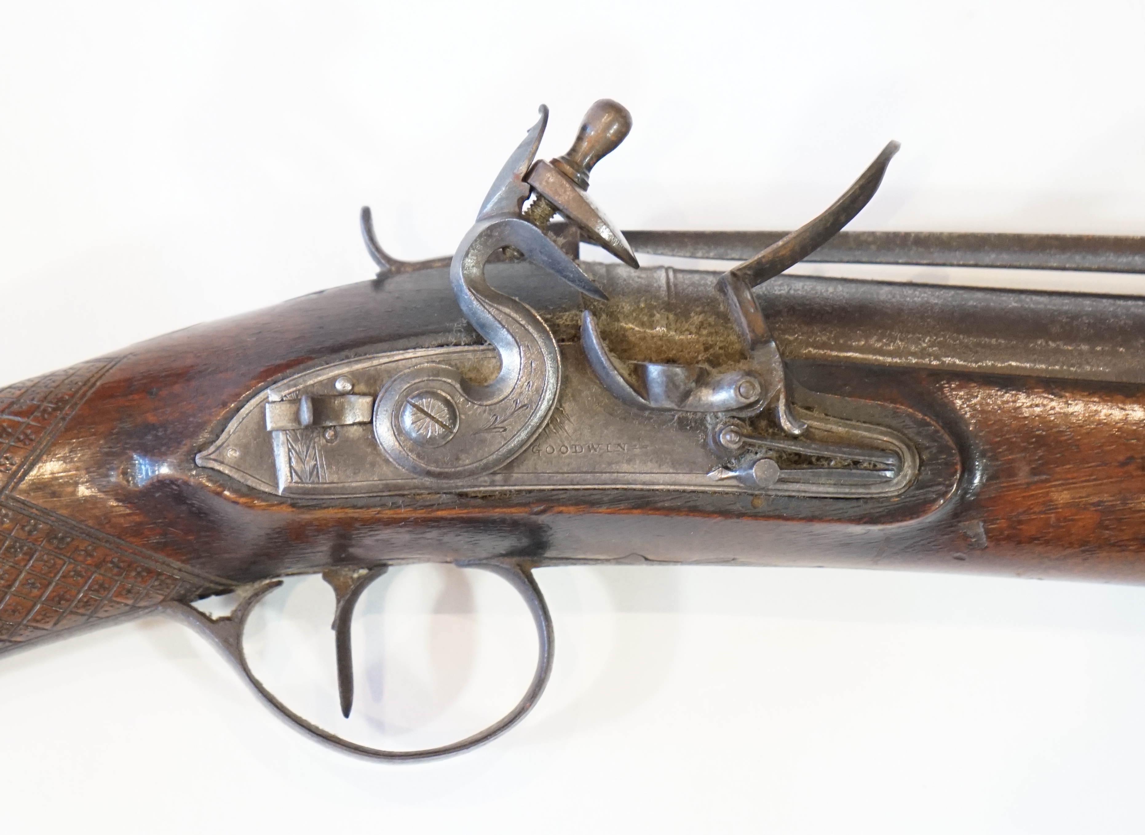 An iron barrelled flintlock blunderbuss by Goodwin of London, fitted with a top spring bayonet
